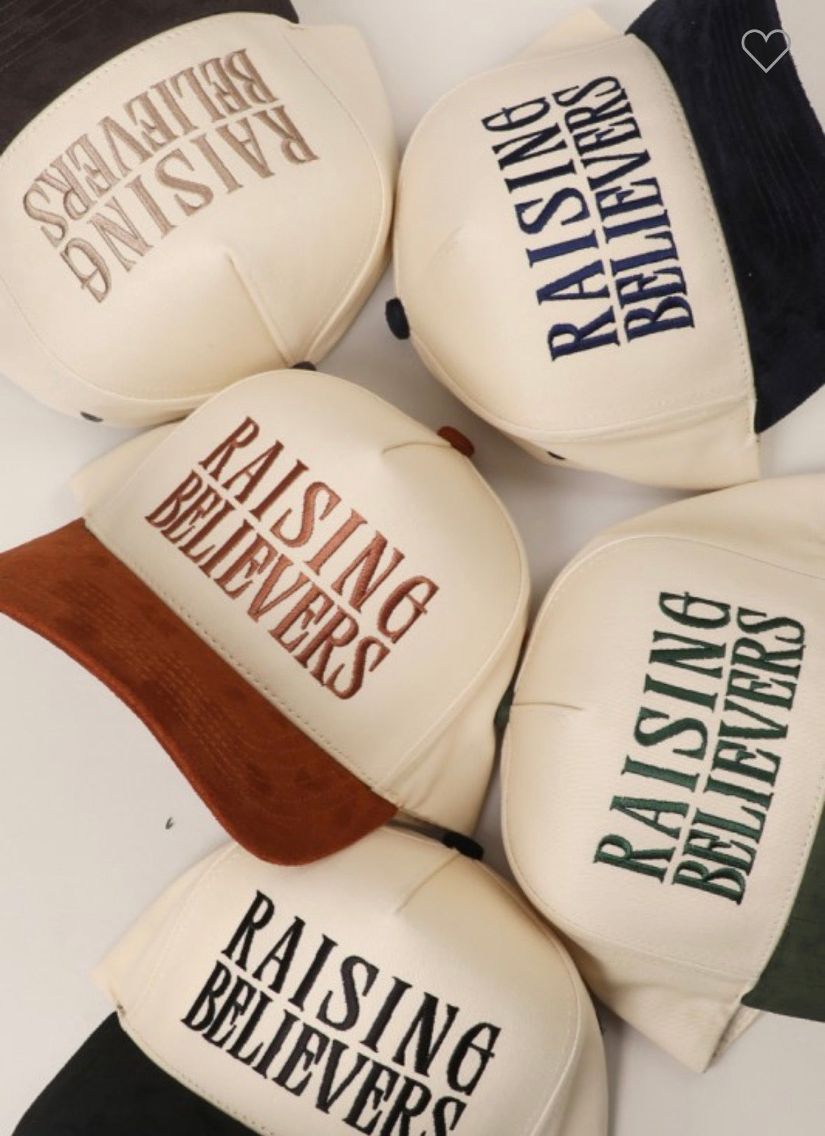 Pair of boxing gloves with 'Raising Believers' text on a white background
