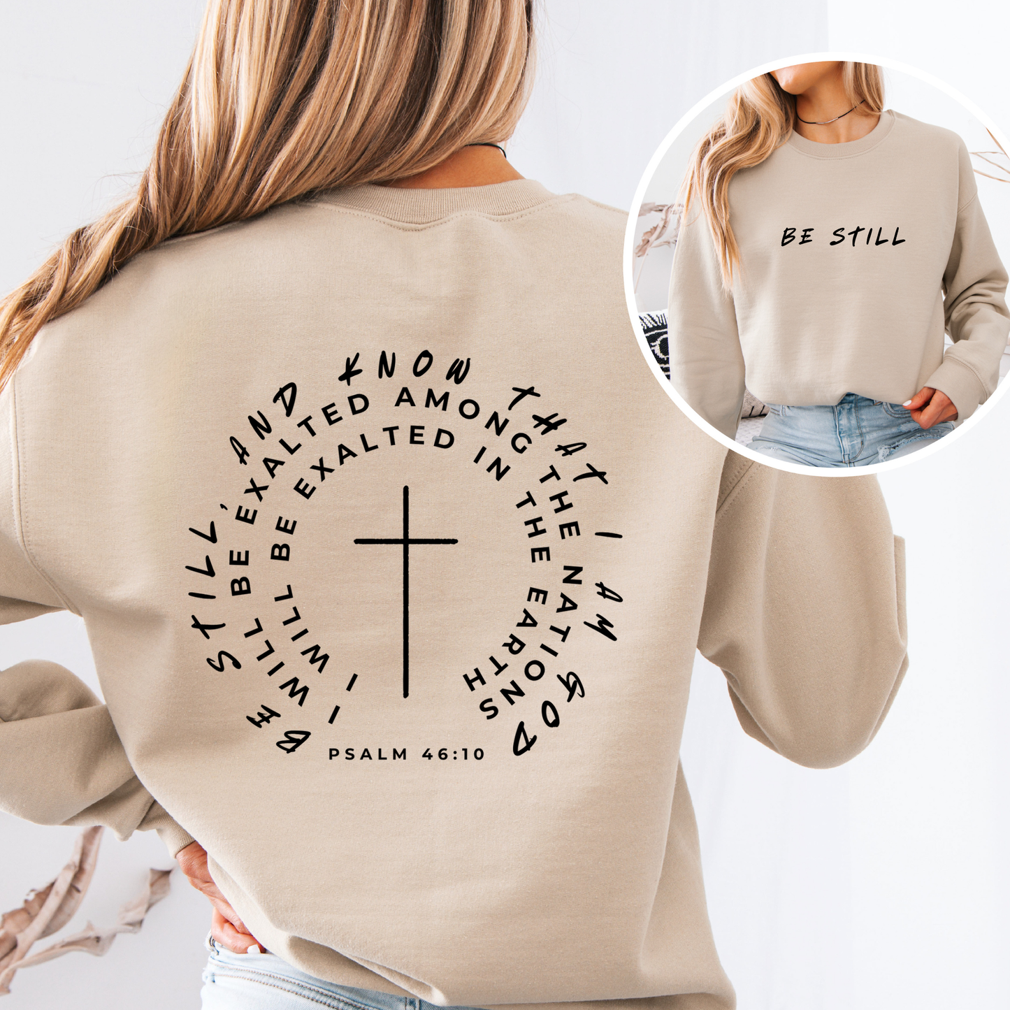 Beige sweatshirt with text and cross design, worn by a person.
